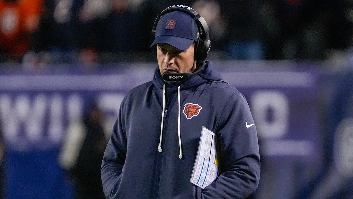 Ben Johnson walks the sideline