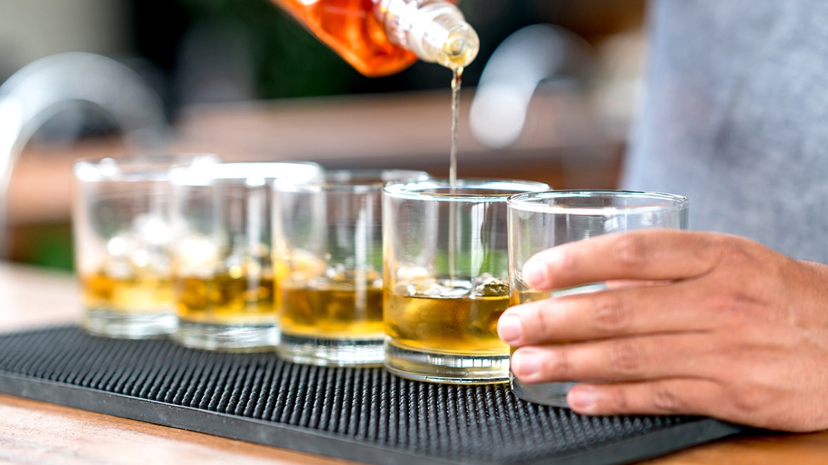 Bartender pouring whiskey