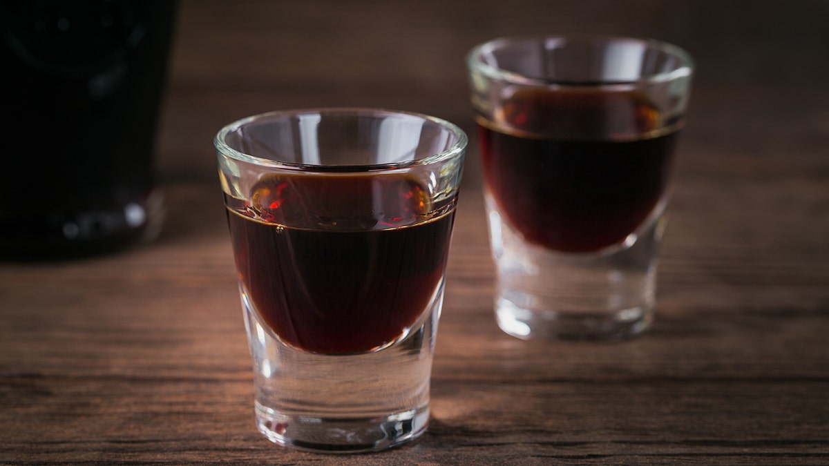 Dark brown alcohol shot at bar
