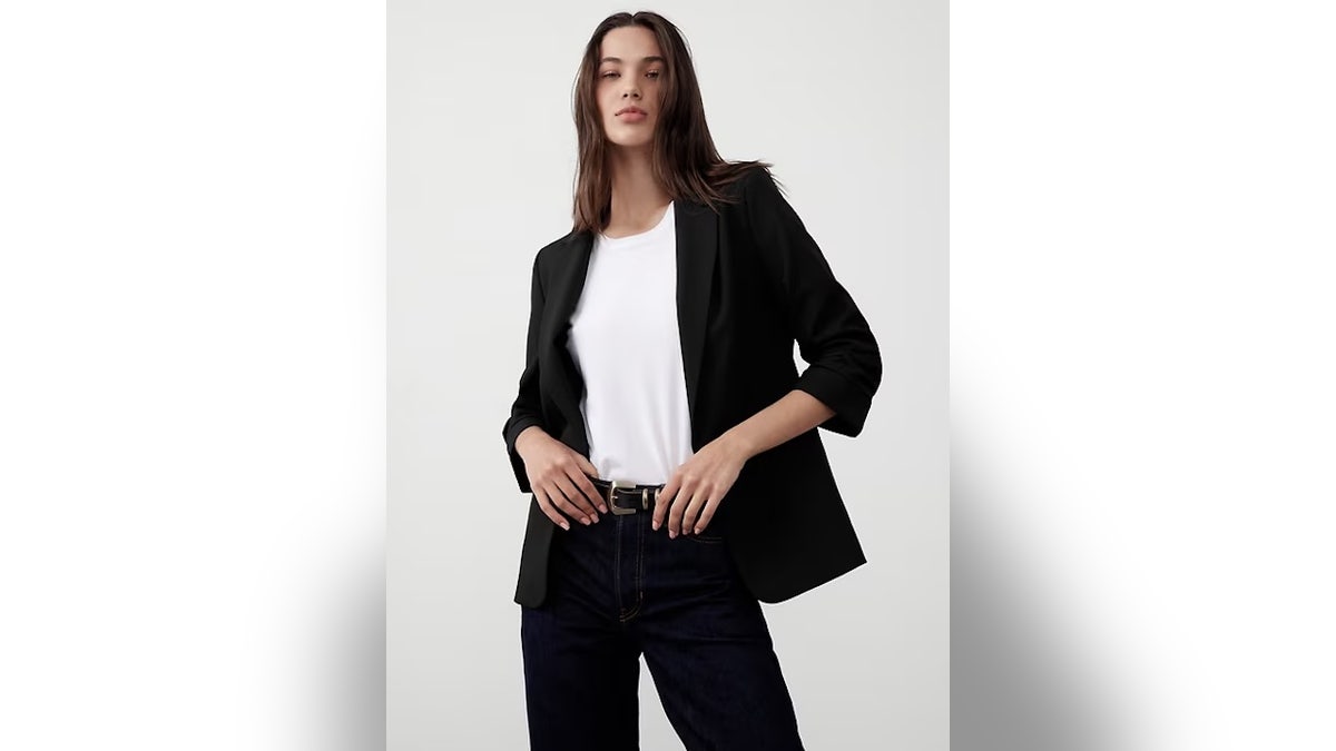 Wrinkle-resistant fabric keeps this blazer looking polished after hours at your desk.