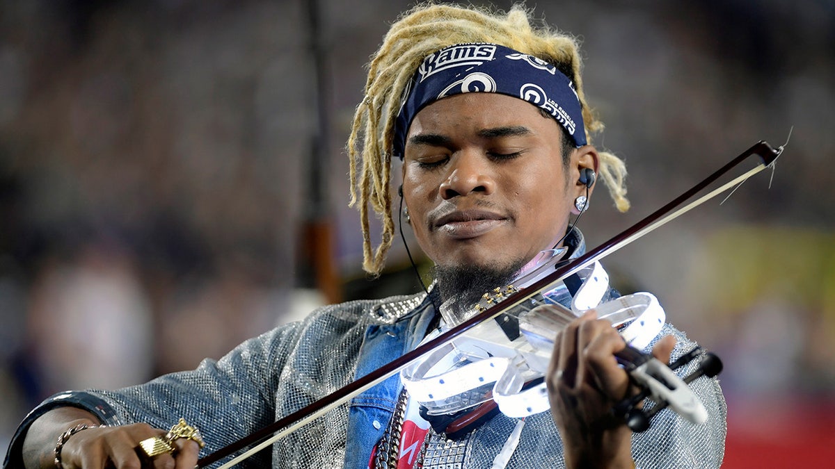 Brian King Joseph plays violin at Super Bowl