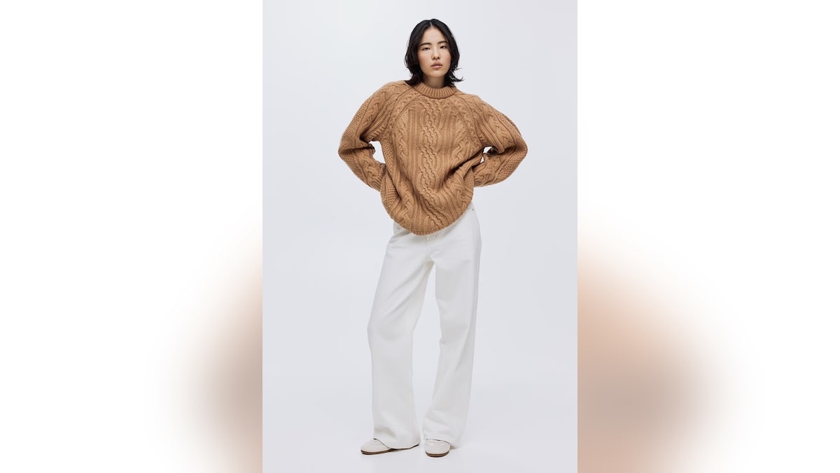 This oversized cable-knit sweater is a cold-weather classic.
