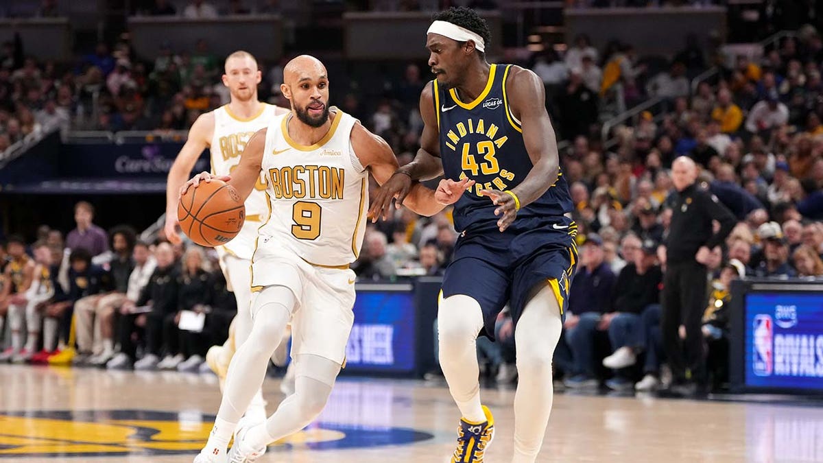 Boston Celtics player dribbles 