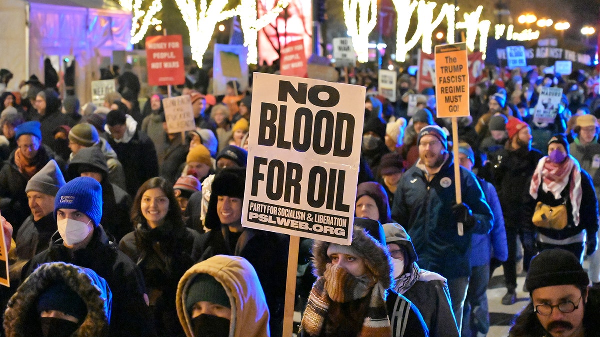Group of Venezuela protesters hold signs in Chicago