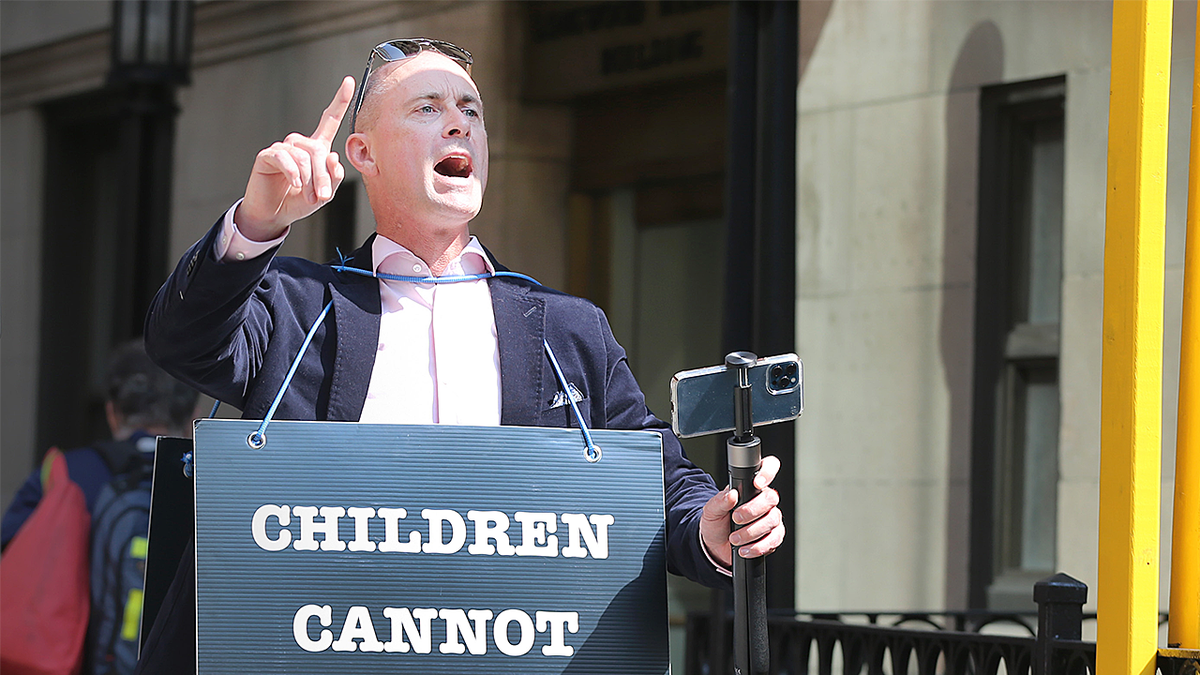 Chris Elston speaking at podium