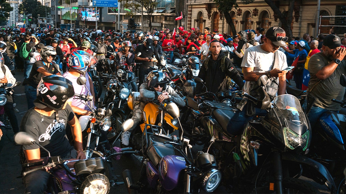 men riding motorcycles flood caracas streets