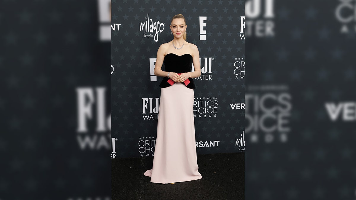 Amanda Seyfried poses on red carpet at Critics Choice Awards.