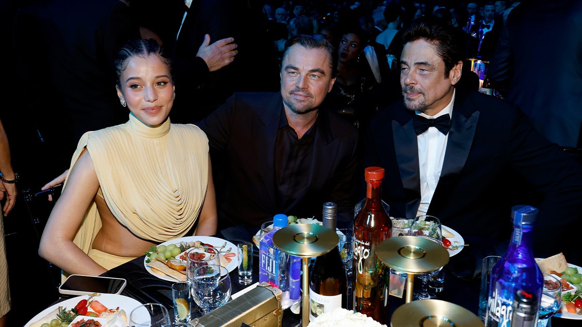 Leonardo DiCaprio sits next to One Battle After Another co-stars Chase Infiniti and Guillermo Del Toro.