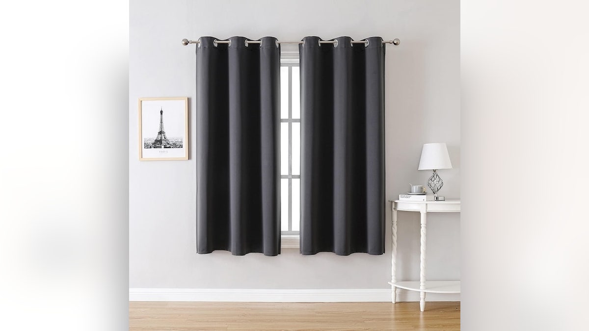 Use blackout curtains to create more insulation in your home.