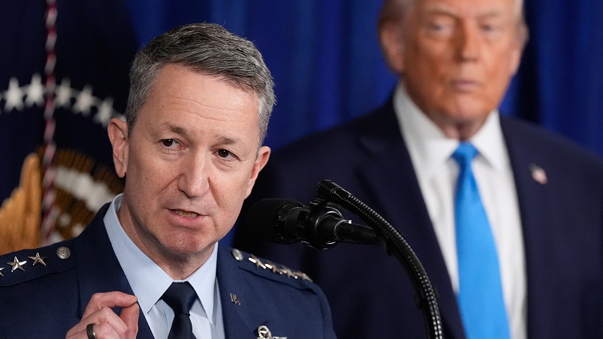 Joint Chiefs of Staff Gen. Dan Caine speaks as President Trump watches on