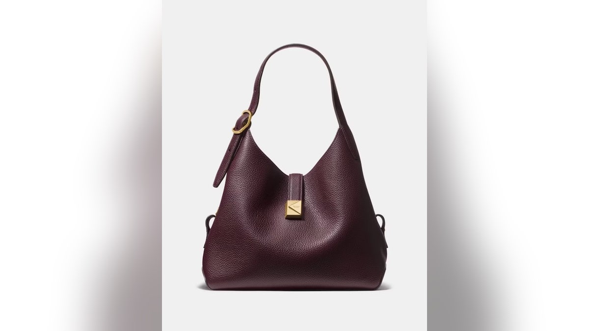 Wear this bag across your body or carry it by the handles. 