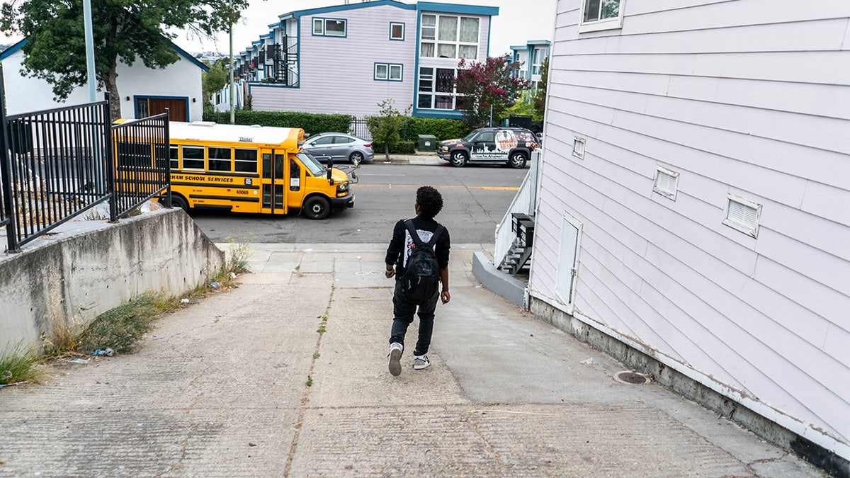 Kid walking to school bus