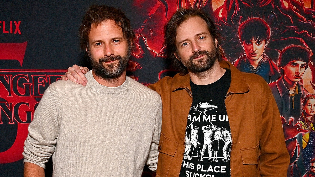 Ross Duffer and Matt Duffer pose together at a fan screening event for the final season of 'Stranger Things.'