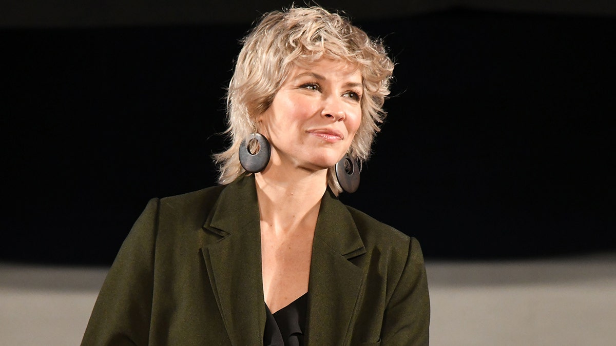 Evangeline Lilly in a green jacket while at Tokyo Comic Con in December 2023.