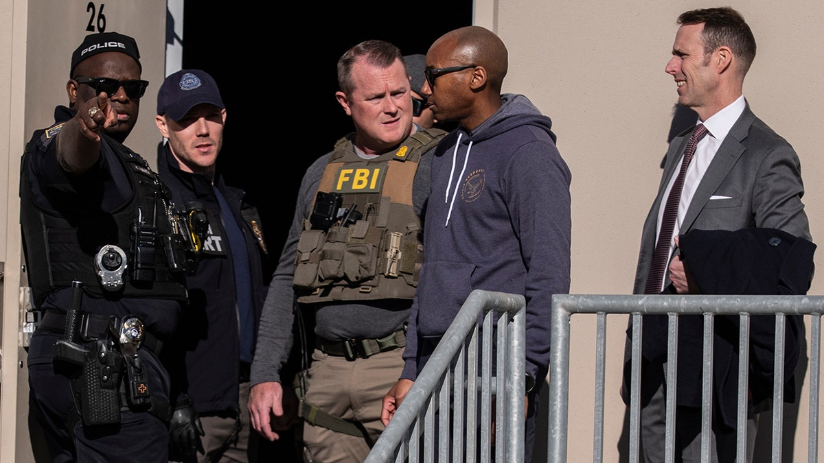 FBI agents standing near the Fulton County Election Hub and Operation Center in Georgia.