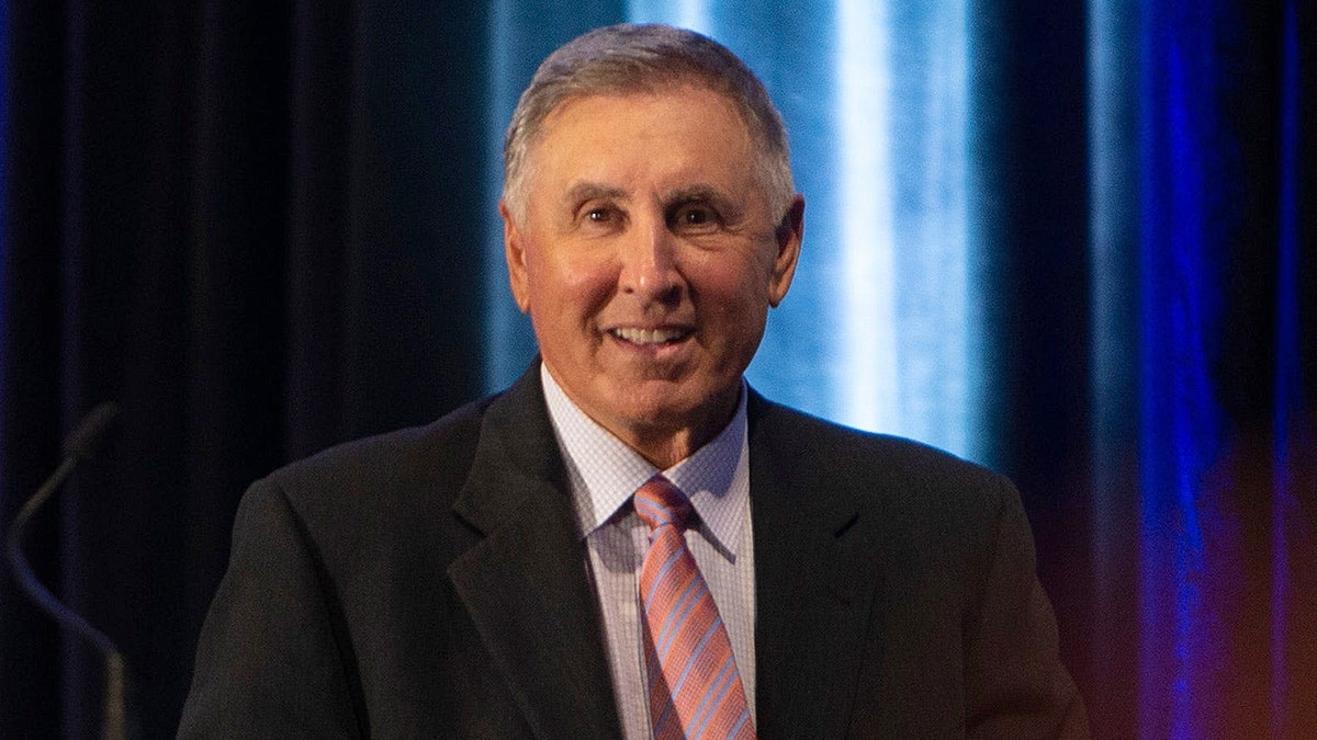 Gary Danielson looks on