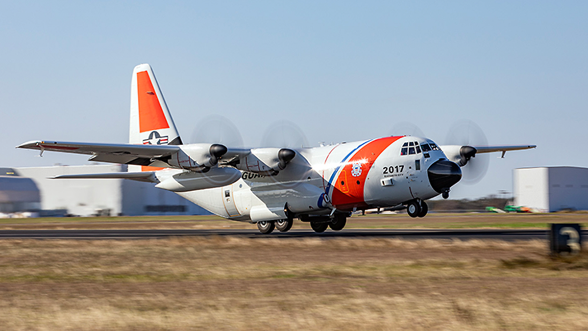 A HC130J U.S. Coast Guard plane takes off.