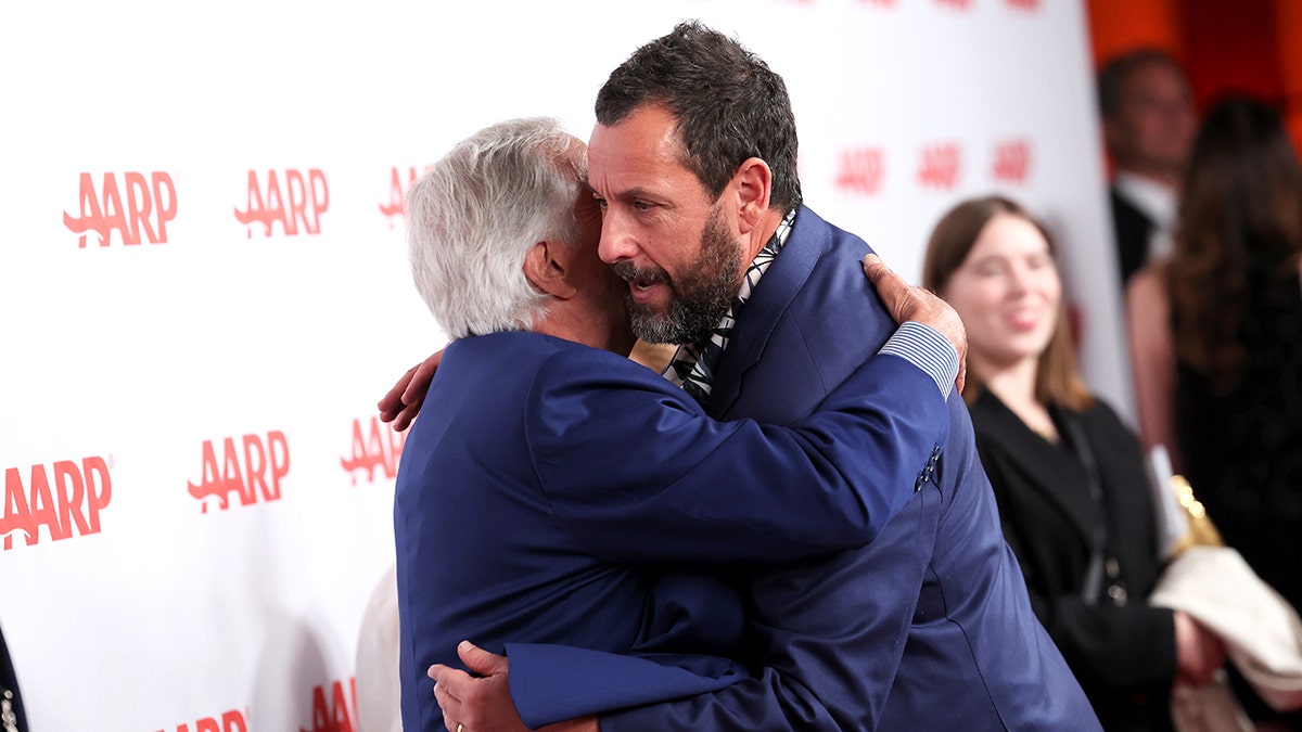 Henry Winkler and Adam Sandler hugging
