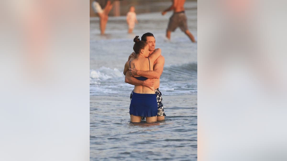 Sutton Foster and Hugh Jackman hug