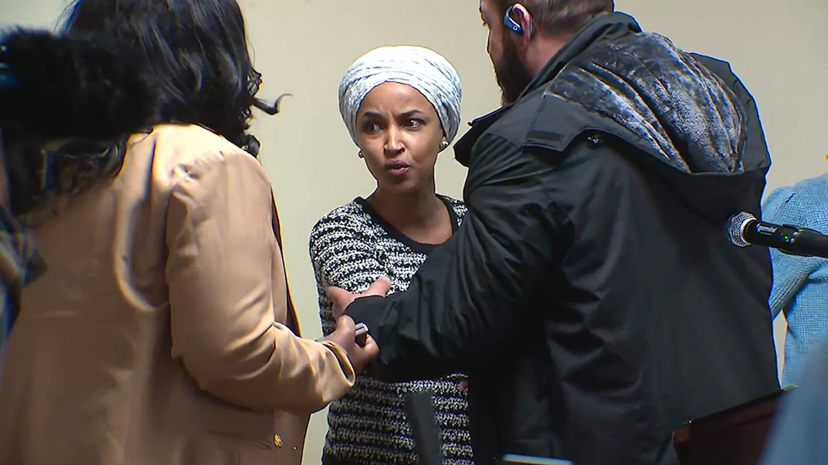 Ilhan Omar sprayed by unknown substance after man charges her at Minneapolis town hall