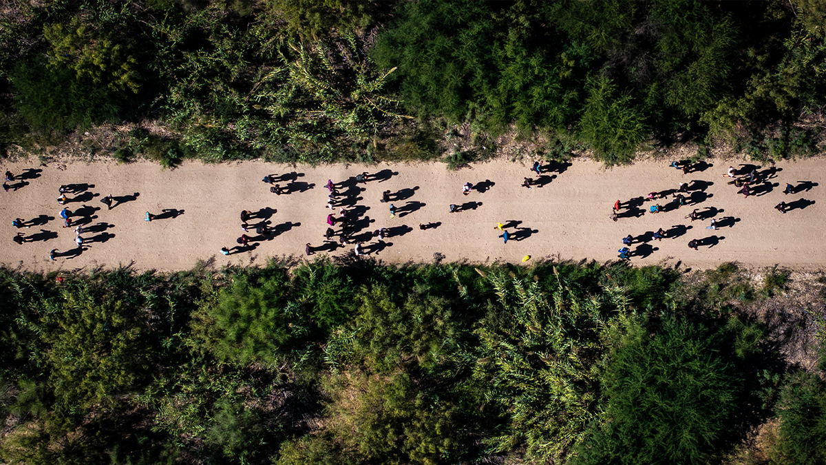Groups of migrants walking across the US-Mexico border photographed from above