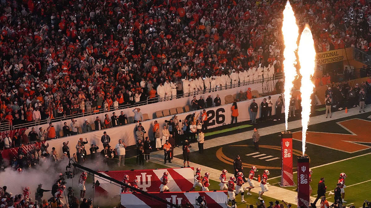 Indiana players run onto the field