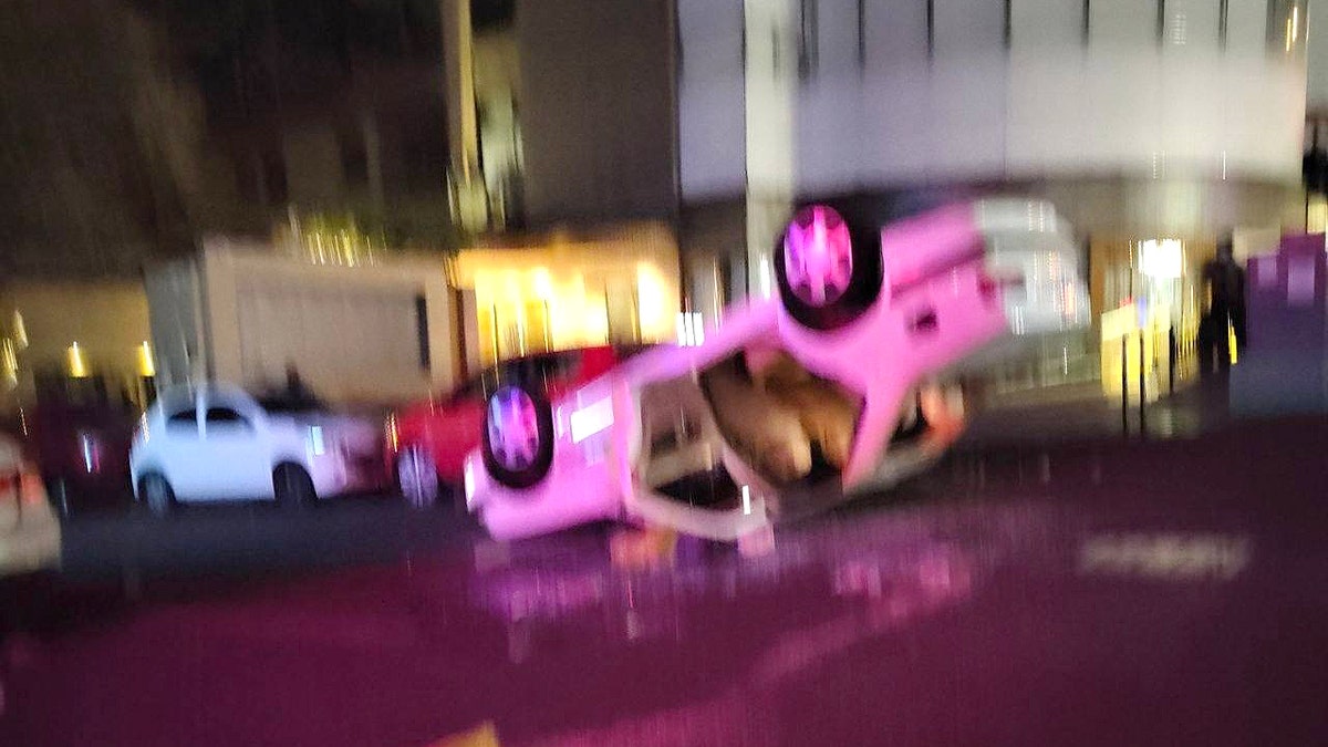 Flipped car in Iran amid protests