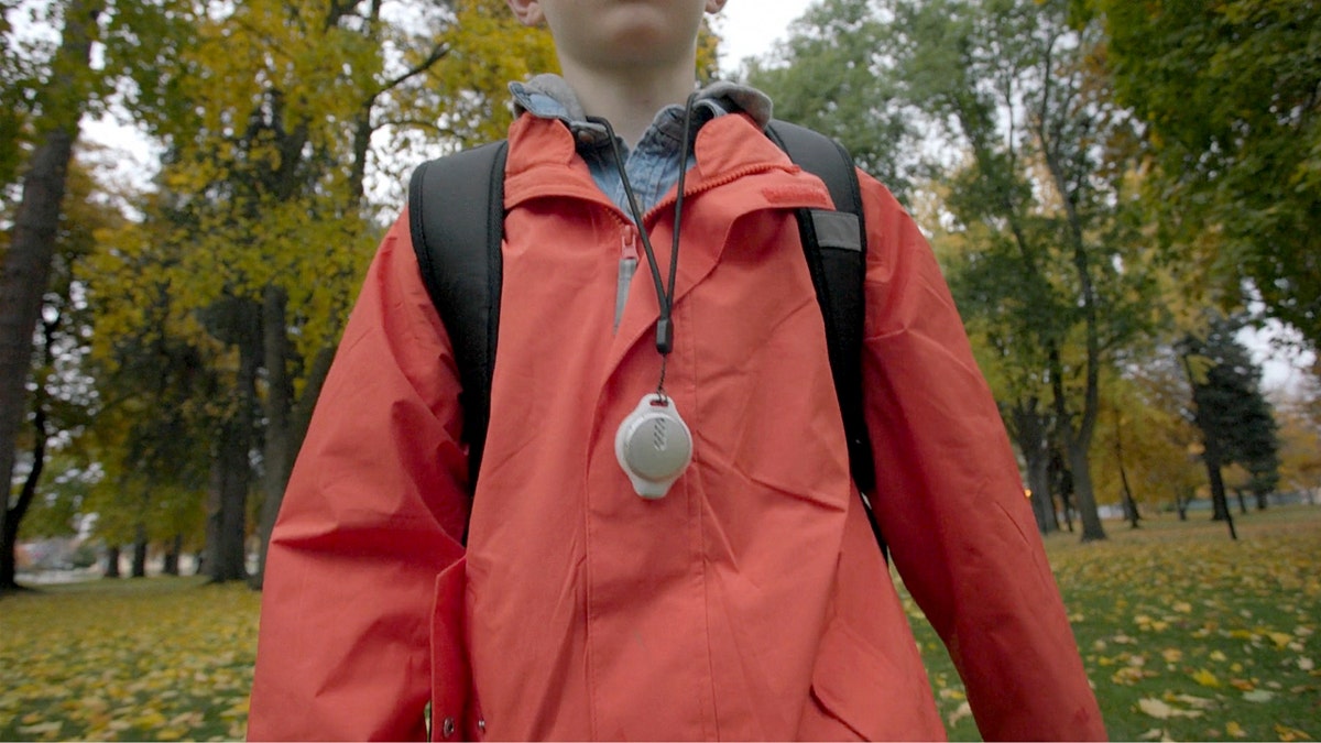 A person wearing a glucose monitor