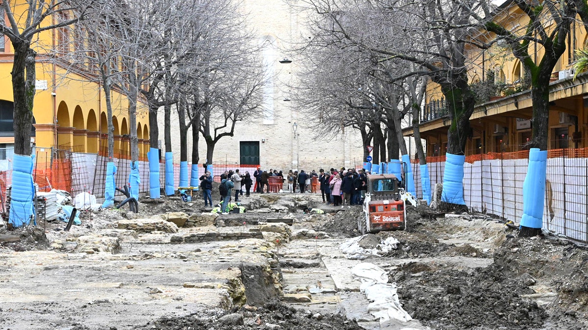 People standing at ancient site