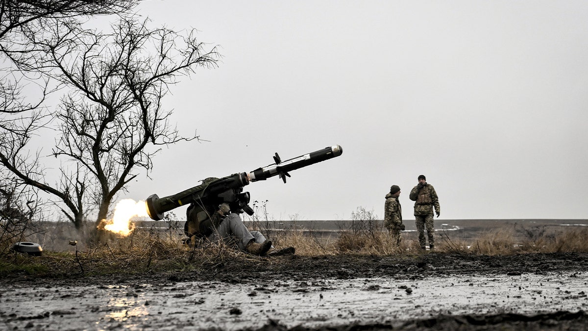 A Ukrainian service member launches a shoulder-fired anti-tank missile during a live-fire exercise.