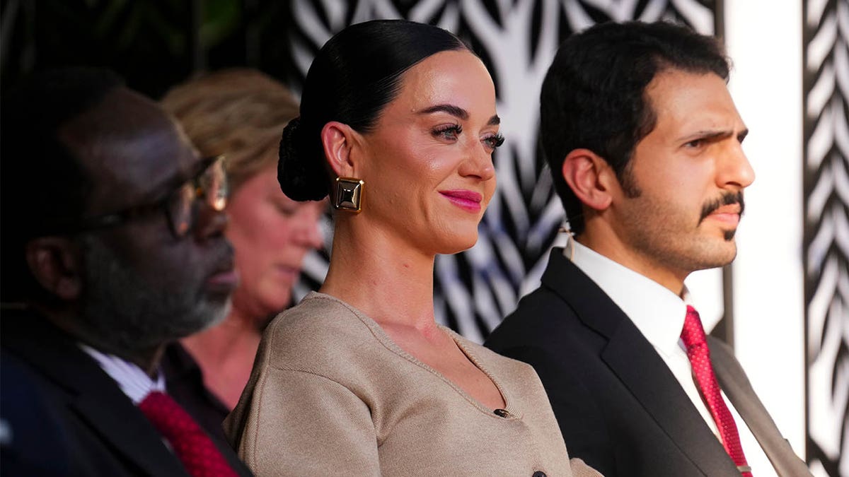 Katy Perry smiles while watching Justin Trudeau's speech