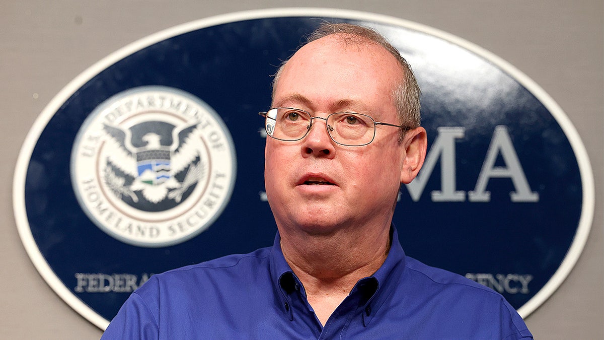 Ken Graham speaks from the podium while speaking to reporters at a press conference.