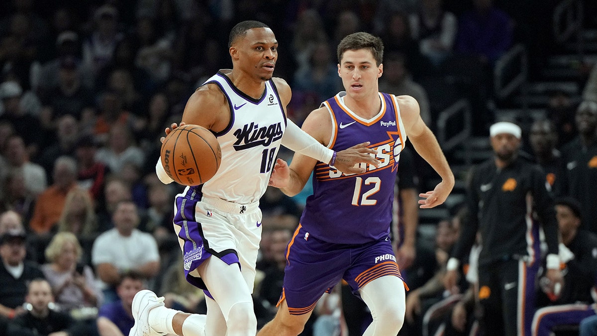 Russell Westbrook dribbles