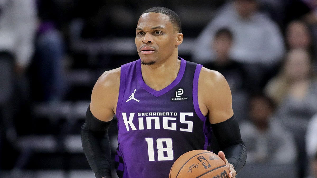 Russell Westbrook dribbles