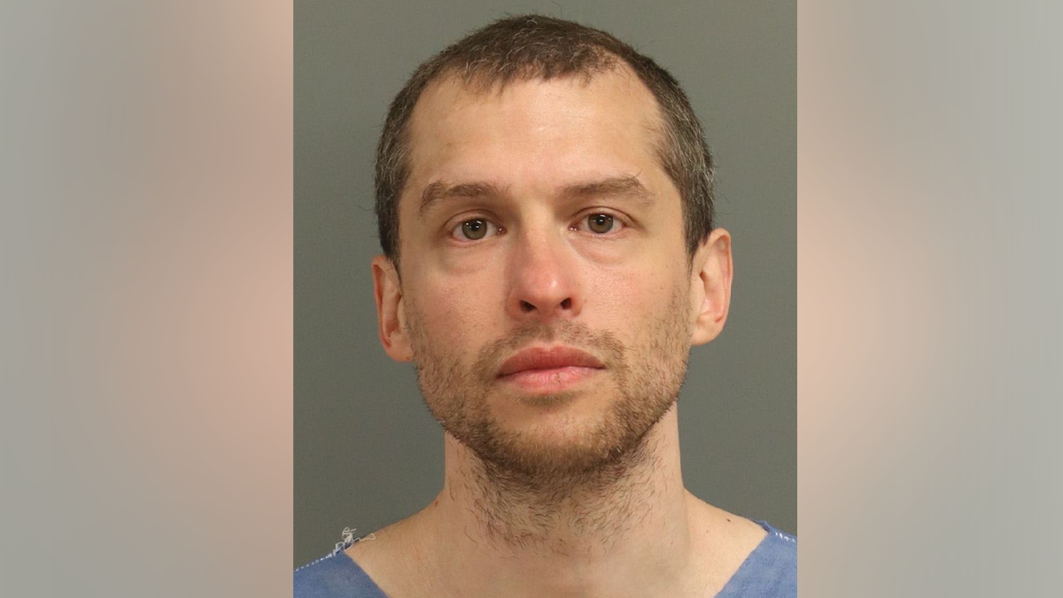 A booking photo shows Ryan Vincent Camacho