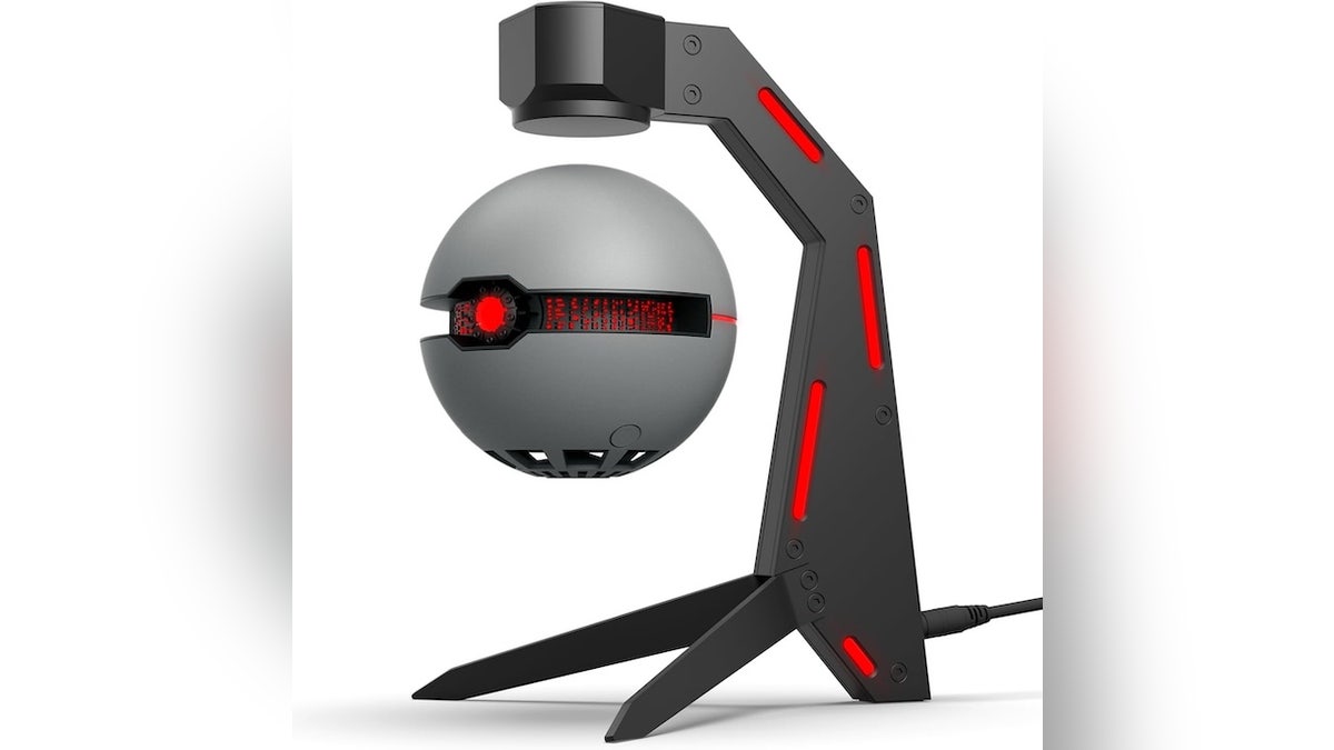 A futuristic speaker that floats and spins in the air.