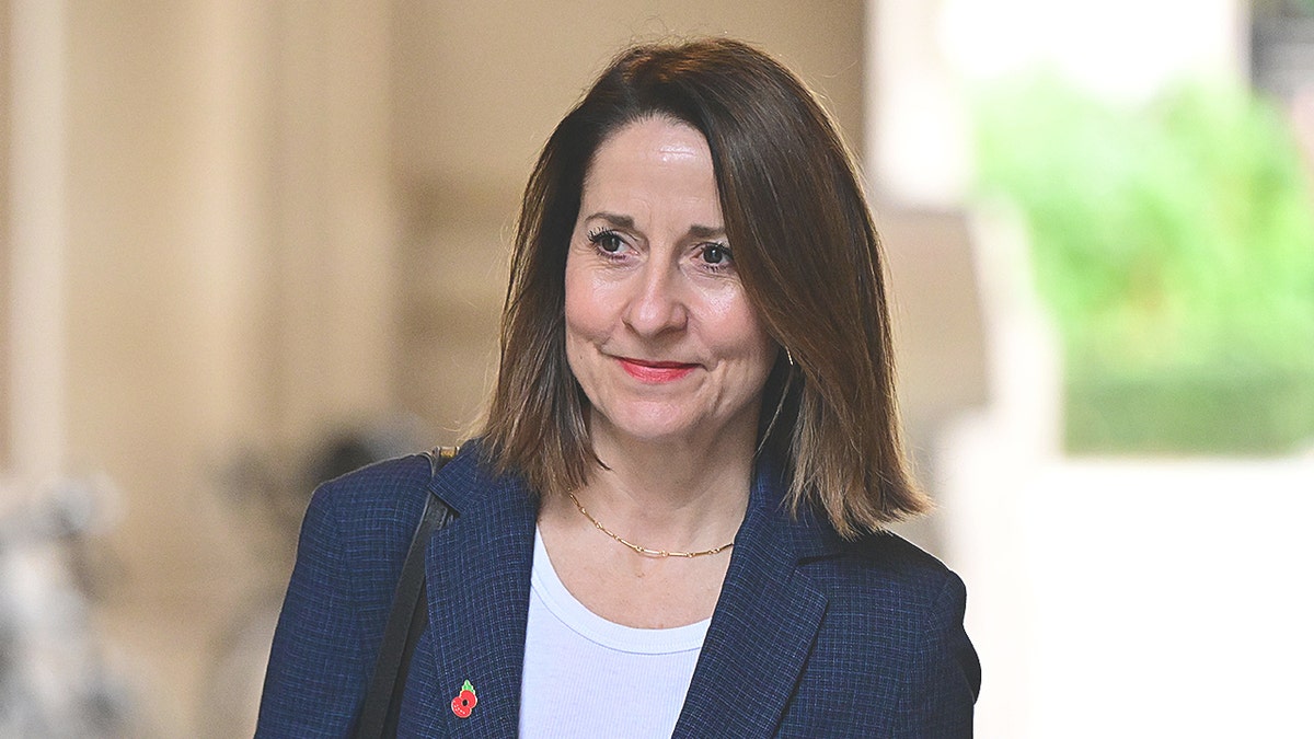 Liz Kendall wearing blue and white.