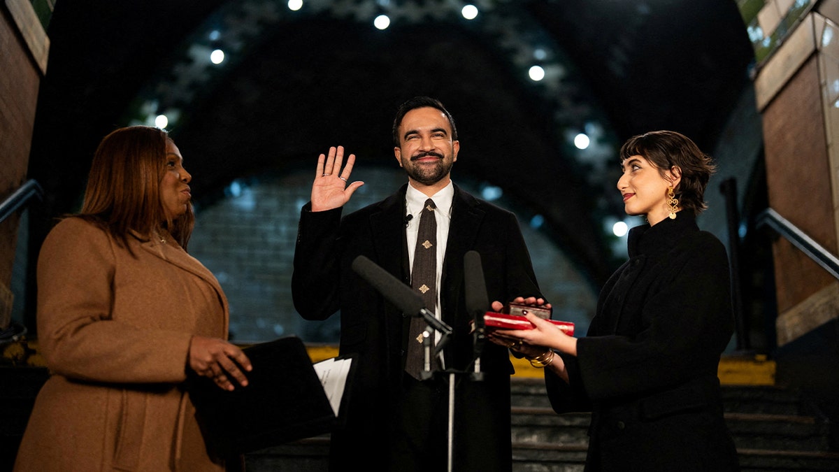 Zohran Mamdani is sworn in as mayor of New York City, flanked by his wife Rama Duwaji and New York Attorney General Letitia James