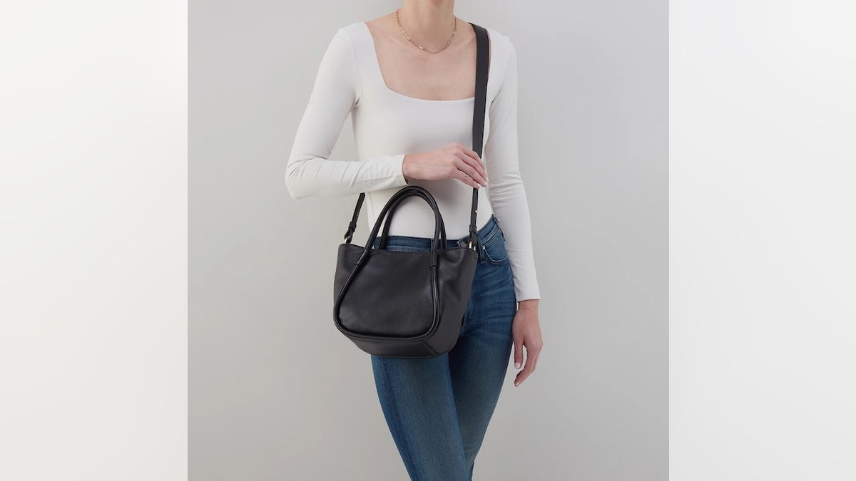 Carry the bag via handles or as a crossbody bag.