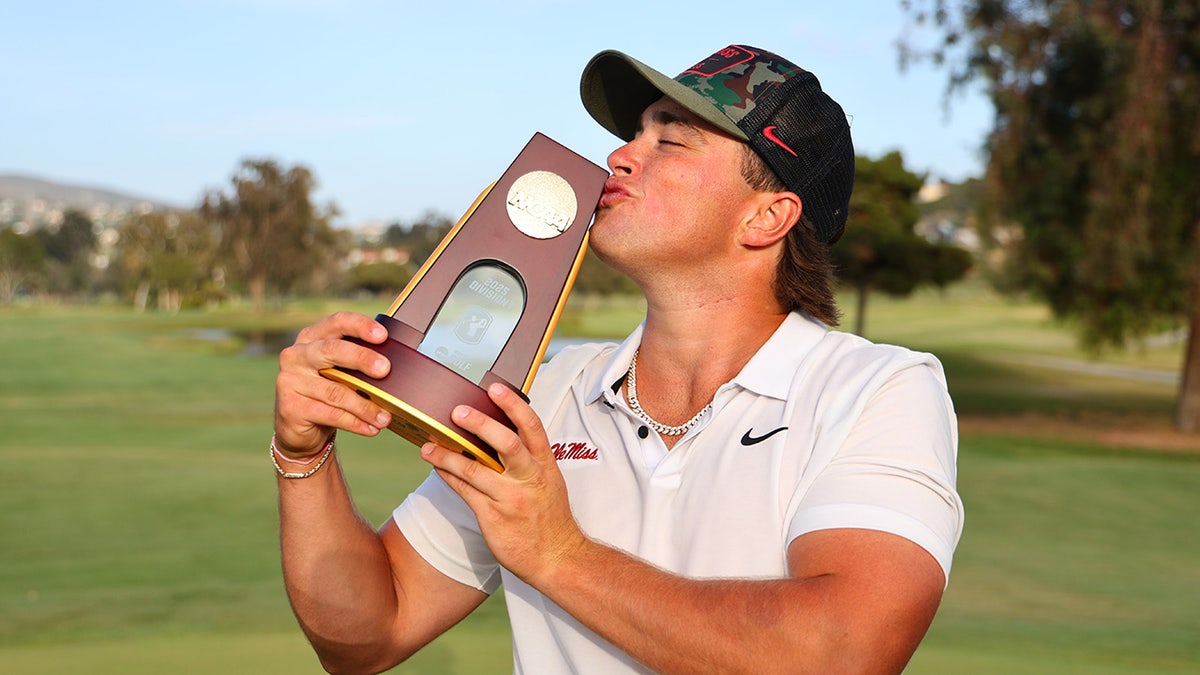 Michael La Sasso kissing trophy