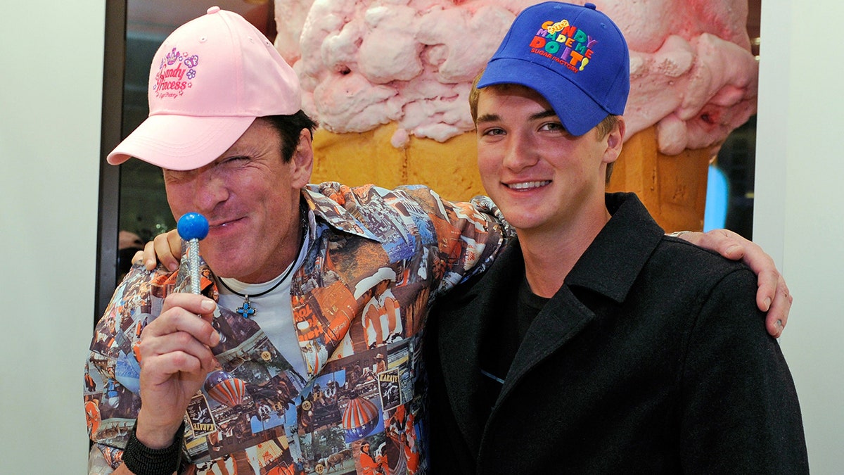 Michael Madsen embracing his smiling son Hudson Madsen.