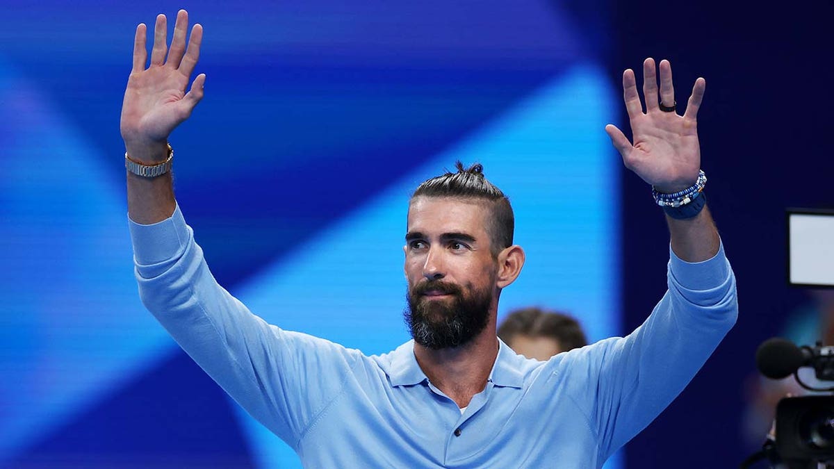 Michael Phelps acknowledge the crowd at the Olympics