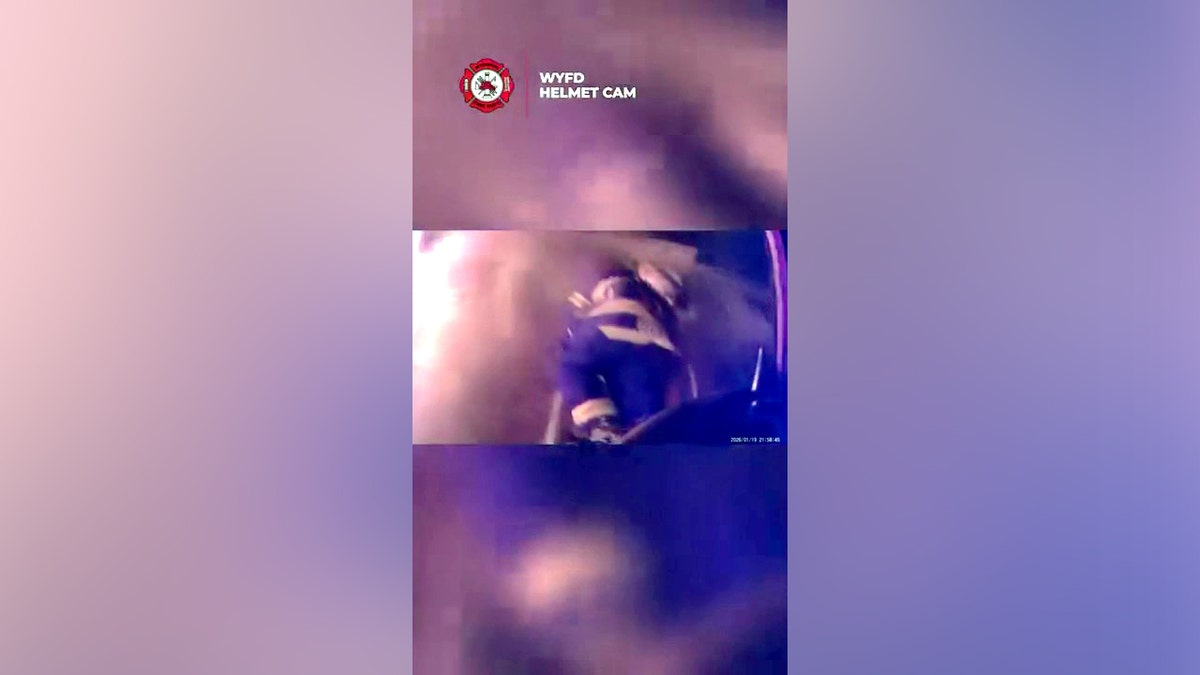 firefighter climbing ladder