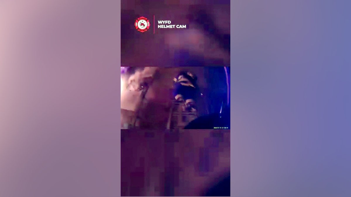 firefighter climbing ladder