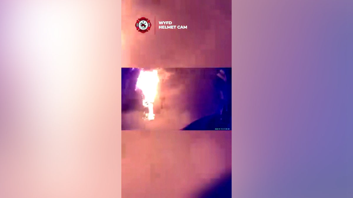 flames bursting from building