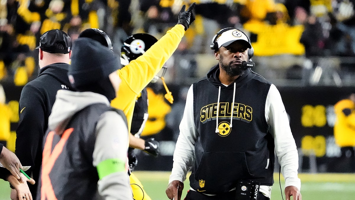 Mike Tomlin looks on
