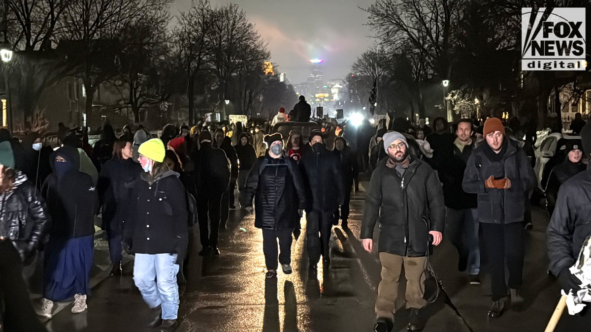 Protesters walk on Portland Street in Minnesota