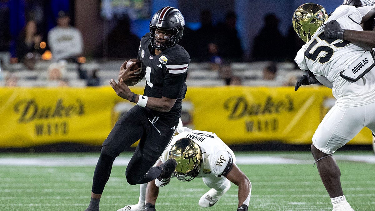 Kamario Taylor runs the ball