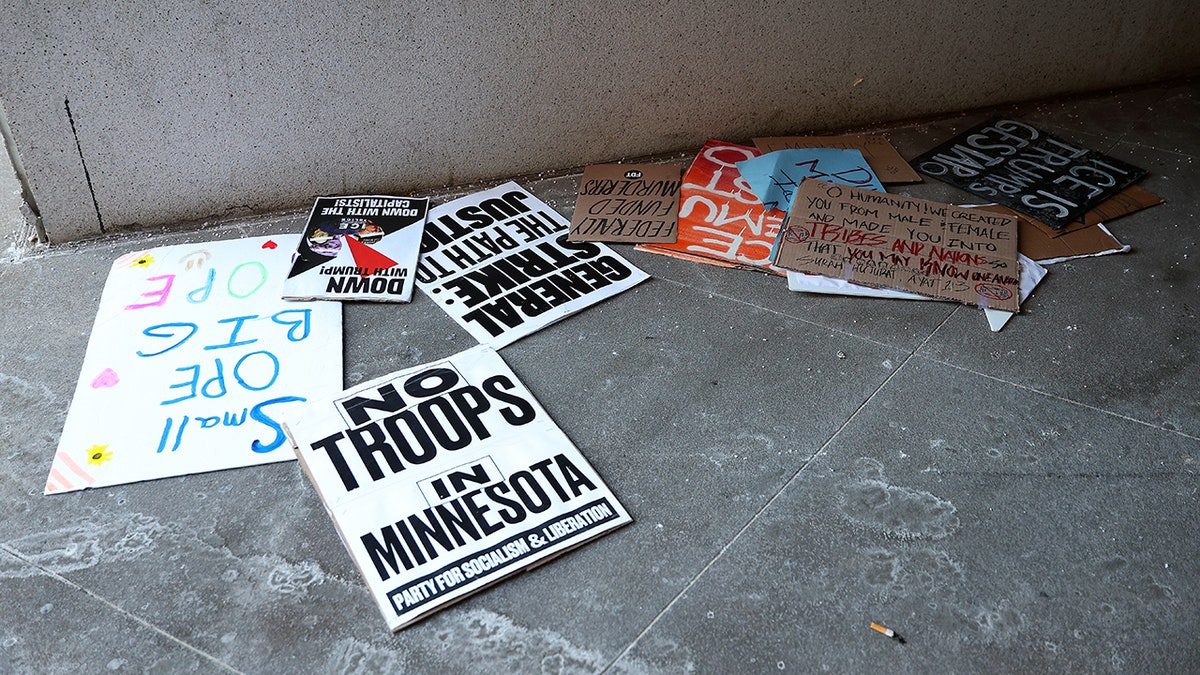 Protester signs litter the street