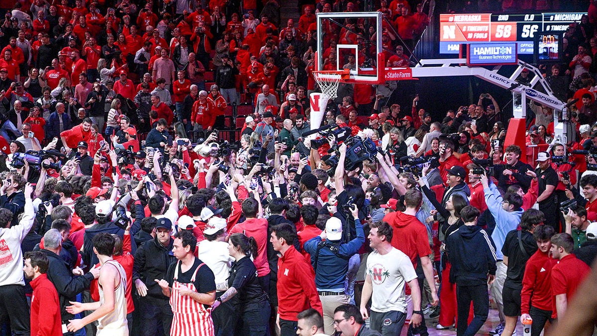 Nebraska fans storm the court